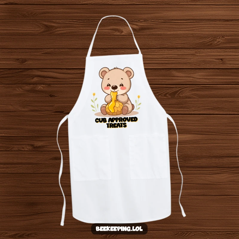 Funny smiling bear cub gently collecting honey from a dripping comb, a functional and humorous cooking apron.