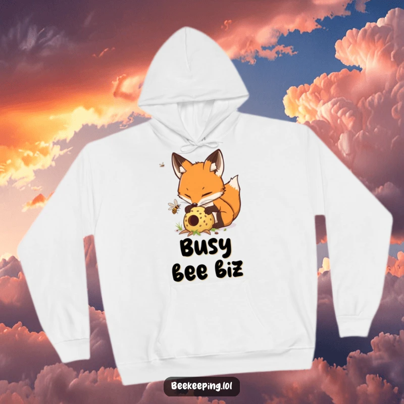 Funny determined fox carefully tending to a buzzing hive, a warm and humorous hooded sweatshirt.