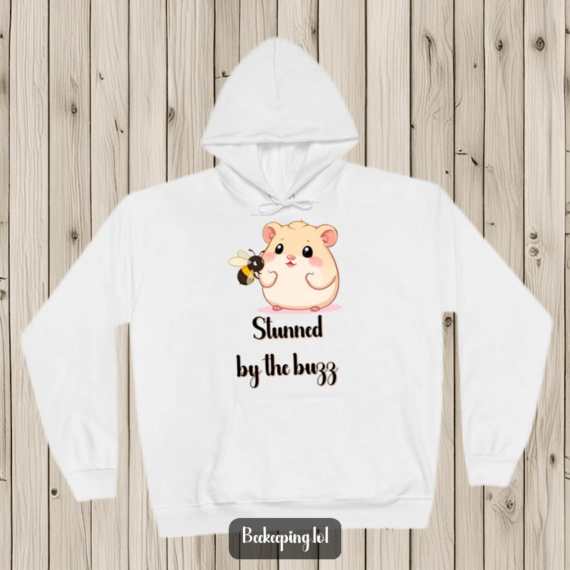 Funny Hamster Hoodie featuring a plump hamster with wide eyes staring at an oversized bee, a cozy and comical depiction of astonishment.