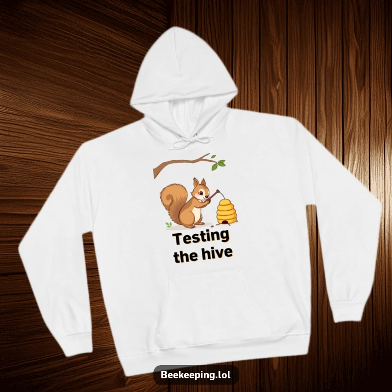 Funny squirrel with a stick gently tapping a beehive on a cozy hoodie, warm and humorous, perfect gift.