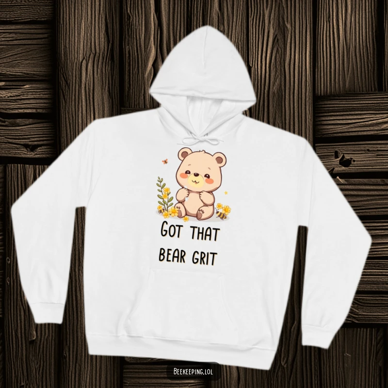 Funny hoodie with a beaming bear carefully gathering propolis, offering a warm, humorous, and comforting design.