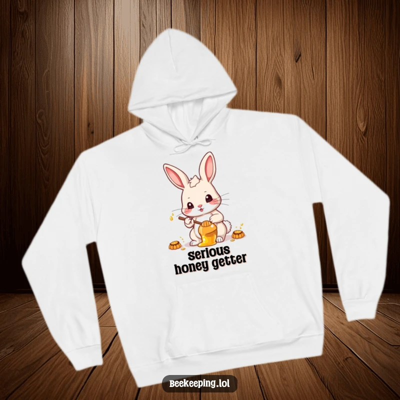Funny determined rabbit collecting honey, radiating grit and warmth on a cozy hoodie.