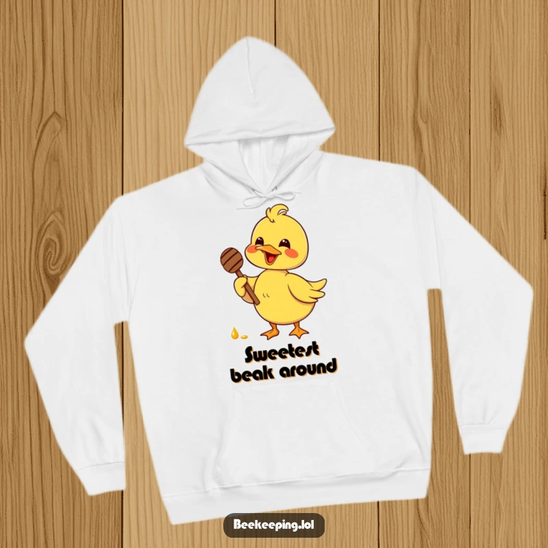 Funny delighted duck holding a honey dipper with glee, depicted on a cozy hoodie, perfect for sweet and humorous relaxation.