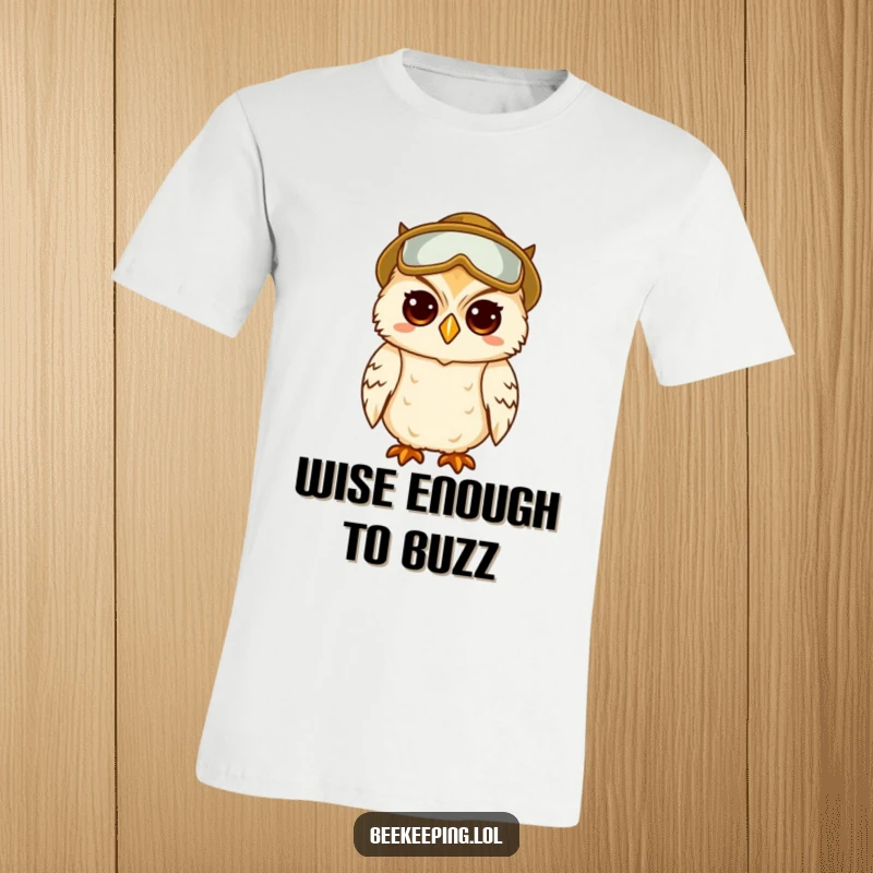 Funny t-shirt graphic of a wise, amused owl meticulously wearing beekeeper protective gear.